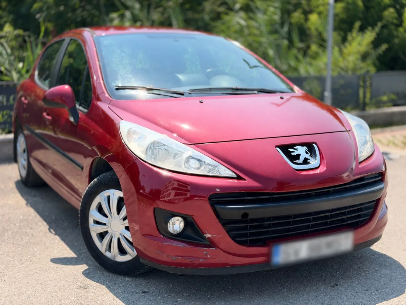 Peugeot 207 2011 roșu exterior față Iași